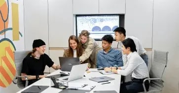 Professionals managing a complex OpenText Archive Server to SharePoint migration