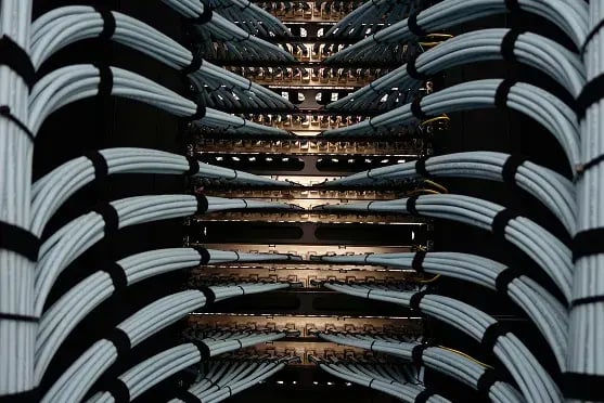 Abstract visualization of enterprise servers and data infrastructure supporting large-scale content migration and AI-ready data processing
